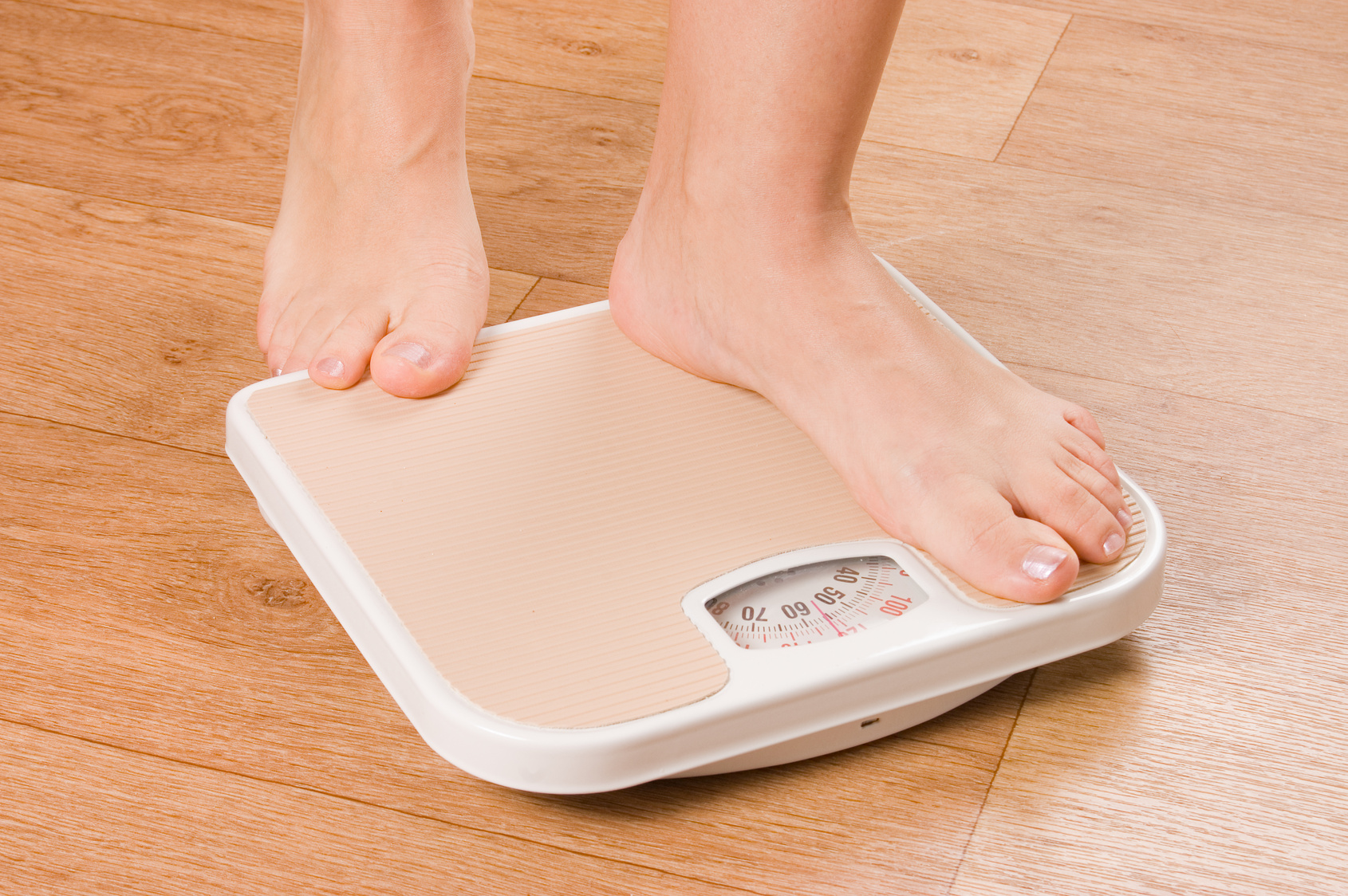 Female feet on scales