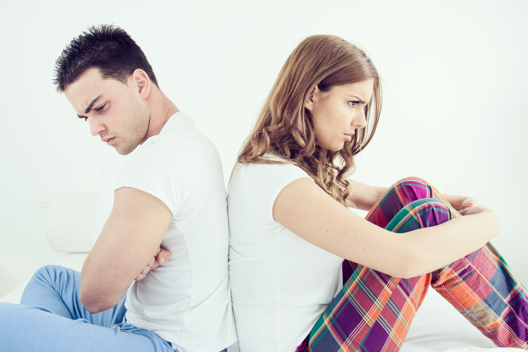 Upset young couple having marital problems