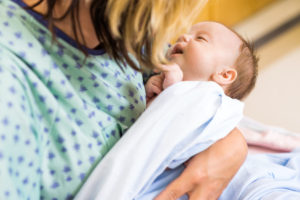 Babygirl Being Carried By Mother In Hospital