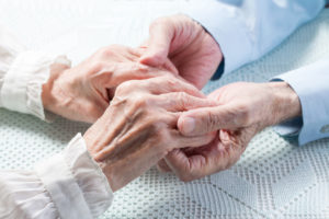 Old people couple holding hands closeup. Happy family.