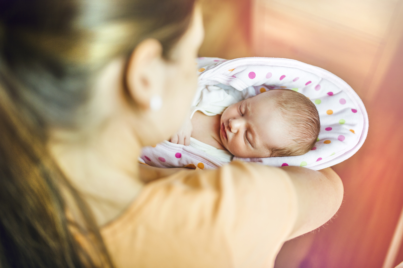 Mom holds baby