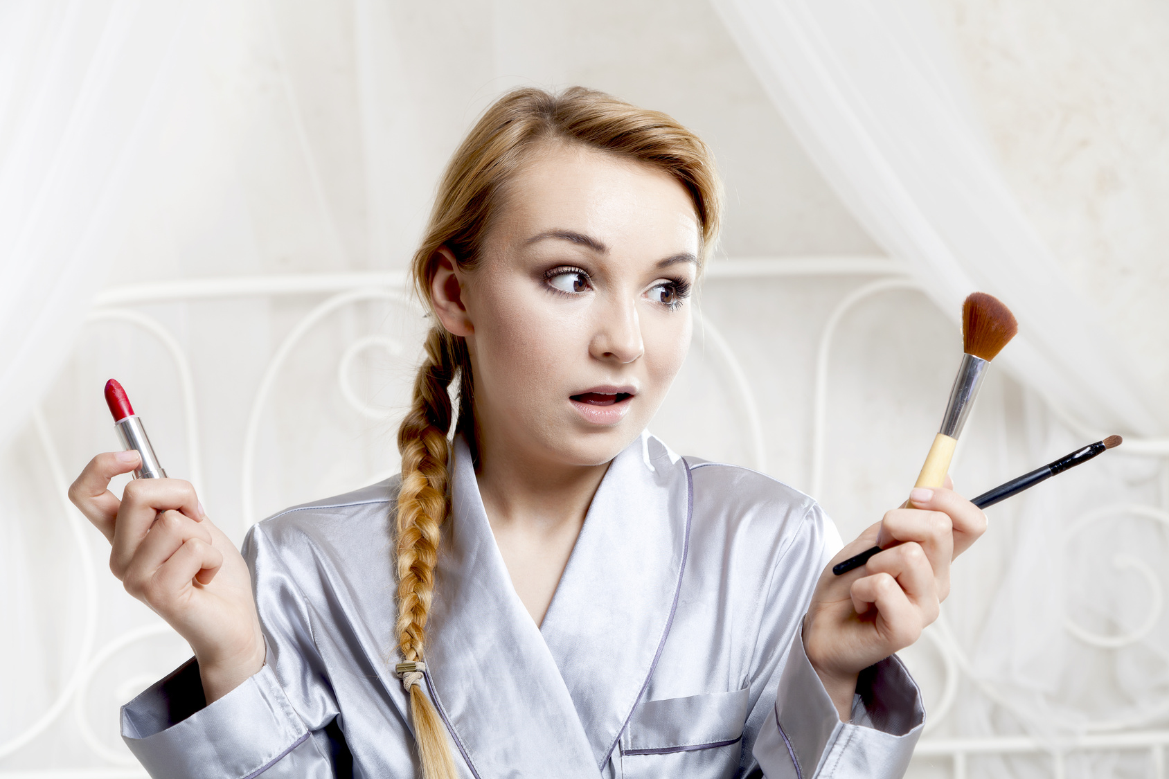 Beautiful woman doing makeup