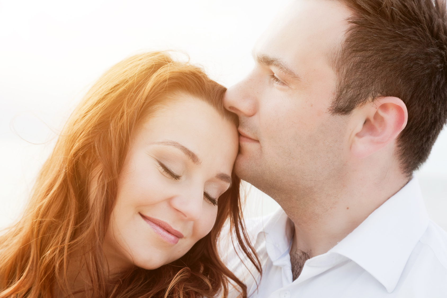 Young happy couple in love. Romantic moment on the beach