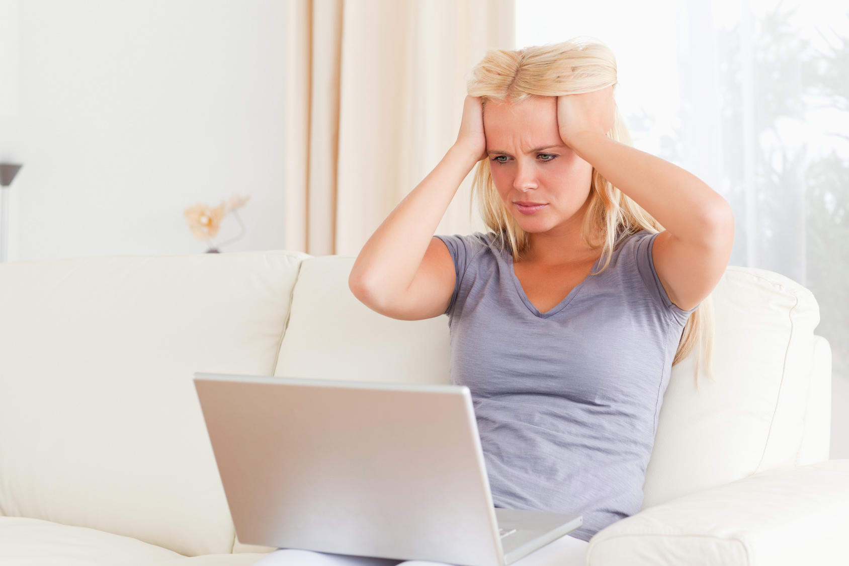 Unhappy woman with a laptop