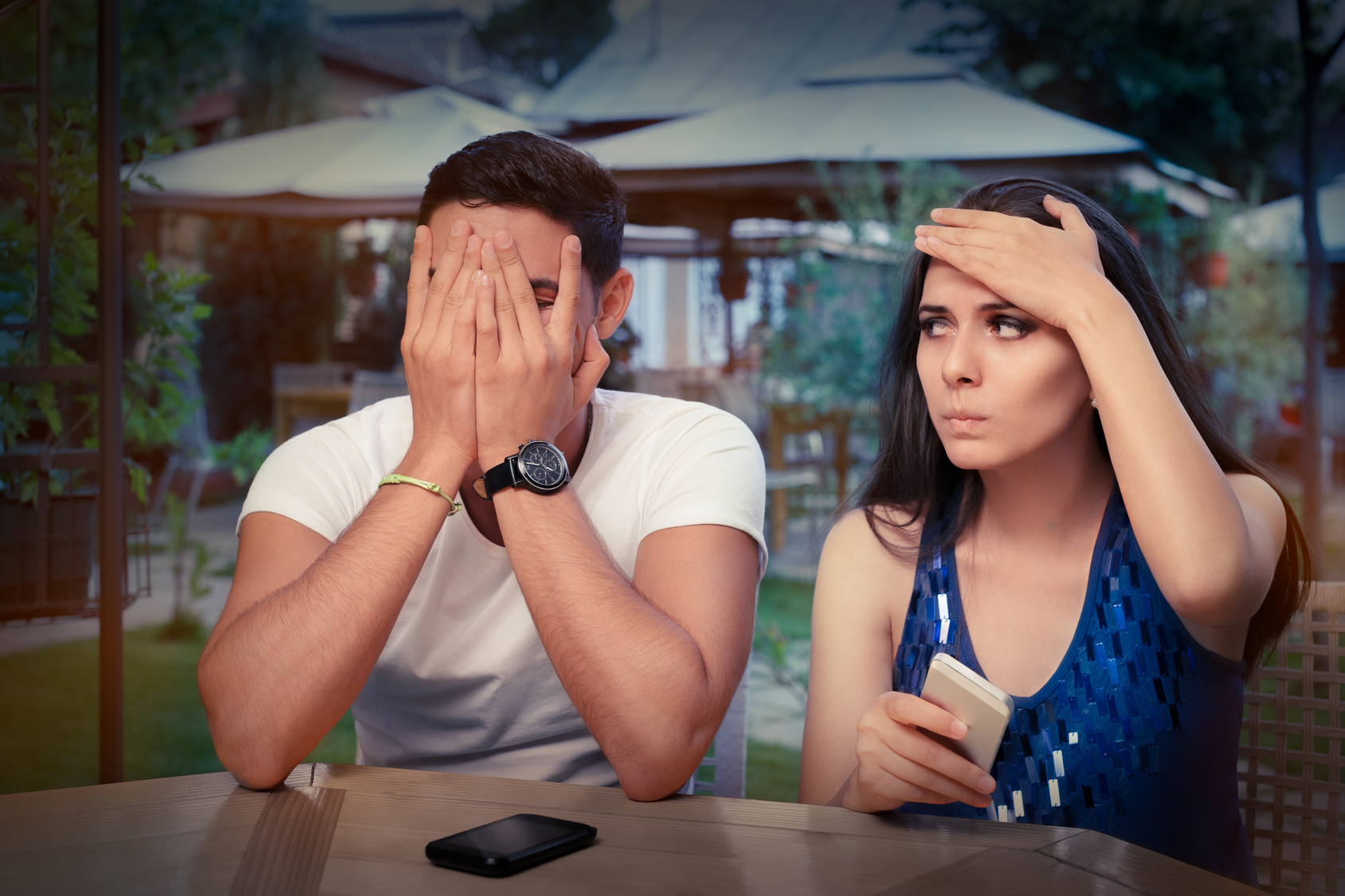 Young Couple Having Problems with Their Smart Phones