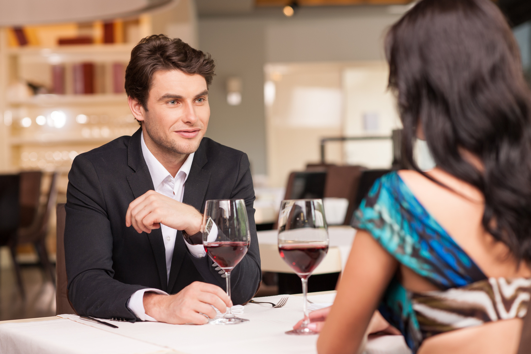 Seducing handsome man looking at beautiful woman