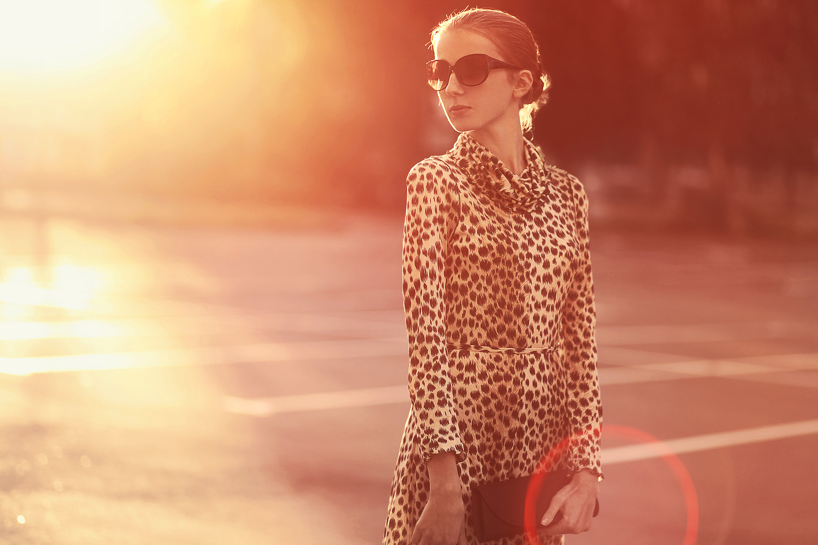 Fashion lifestyle portrait woman in a dress with leopard print