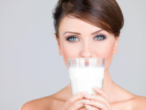 Gorgeous woman with a glass of fresh milk