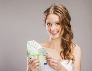Woman holds money euros