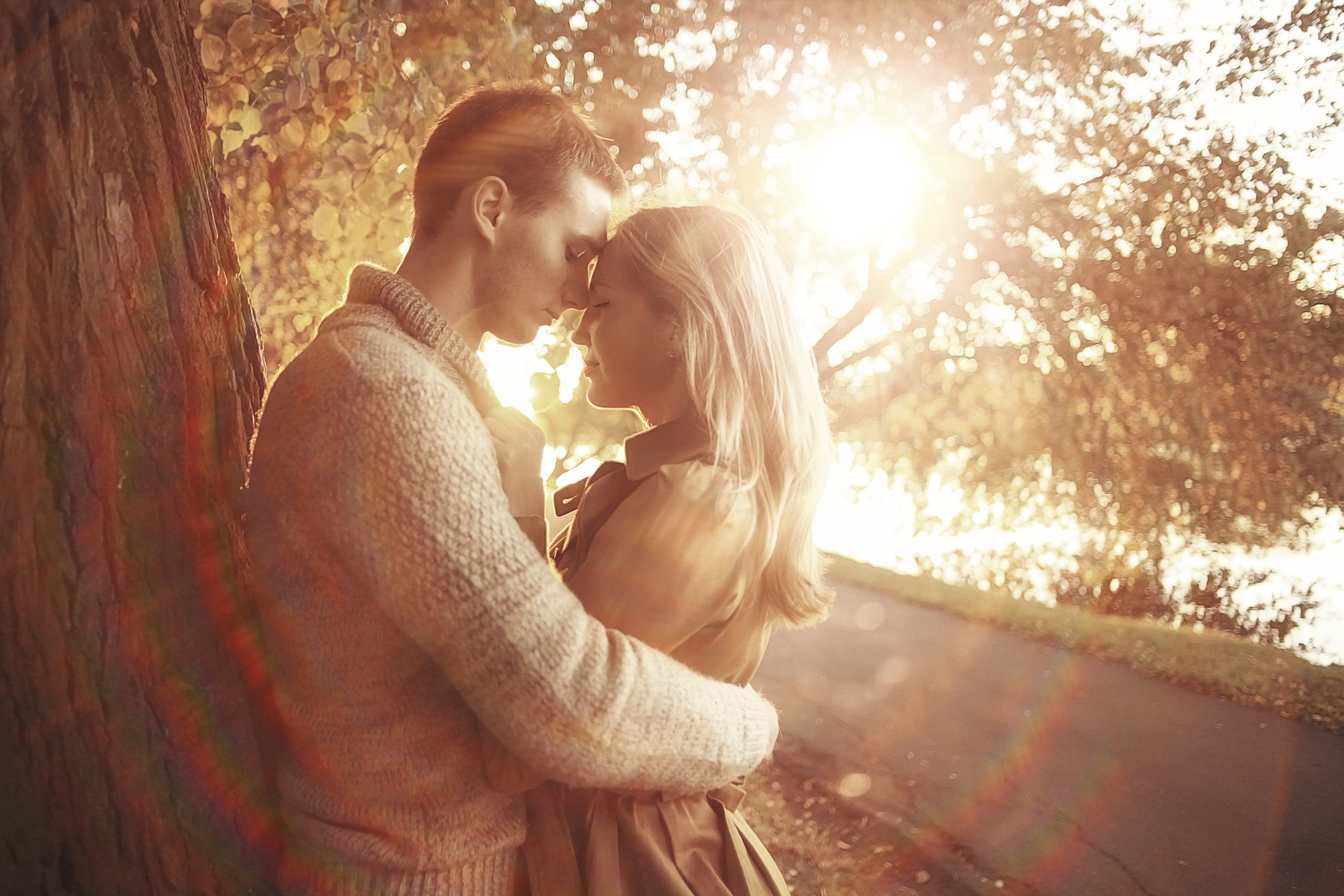 loving couple in autumn park sunbeams sunset