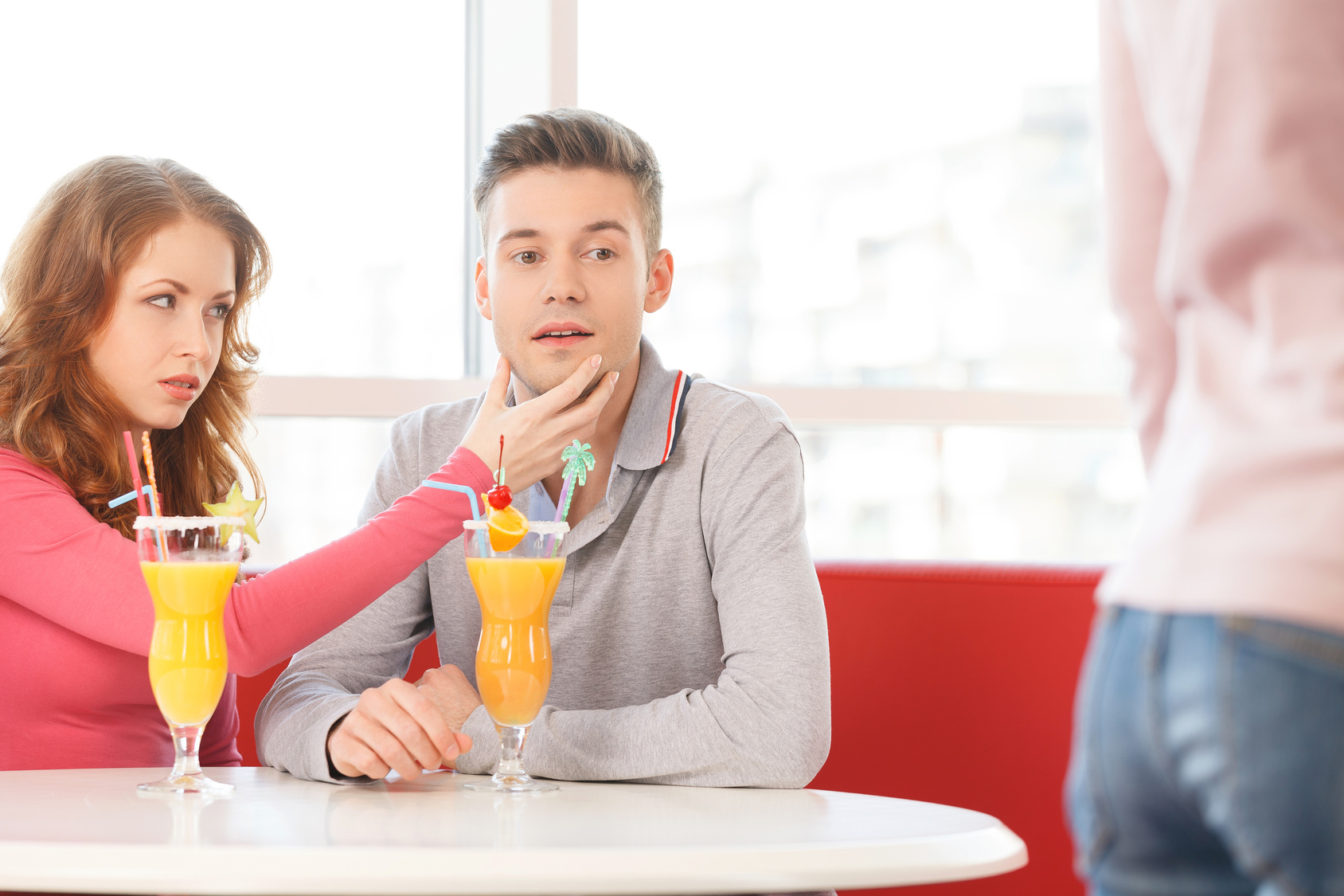 young man looking at nice girl passing by.