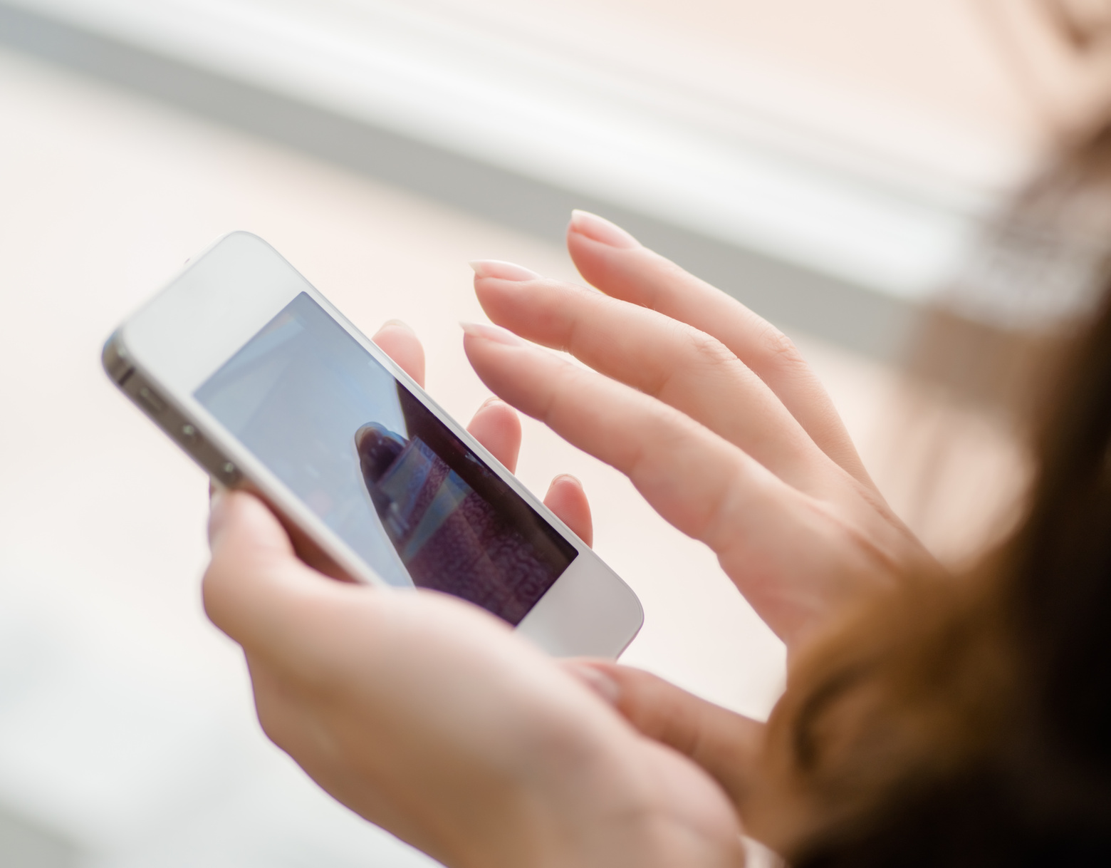 woman uses a smartphone