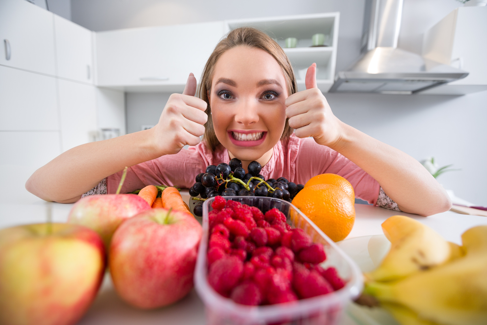 Young girl with lot of fruits