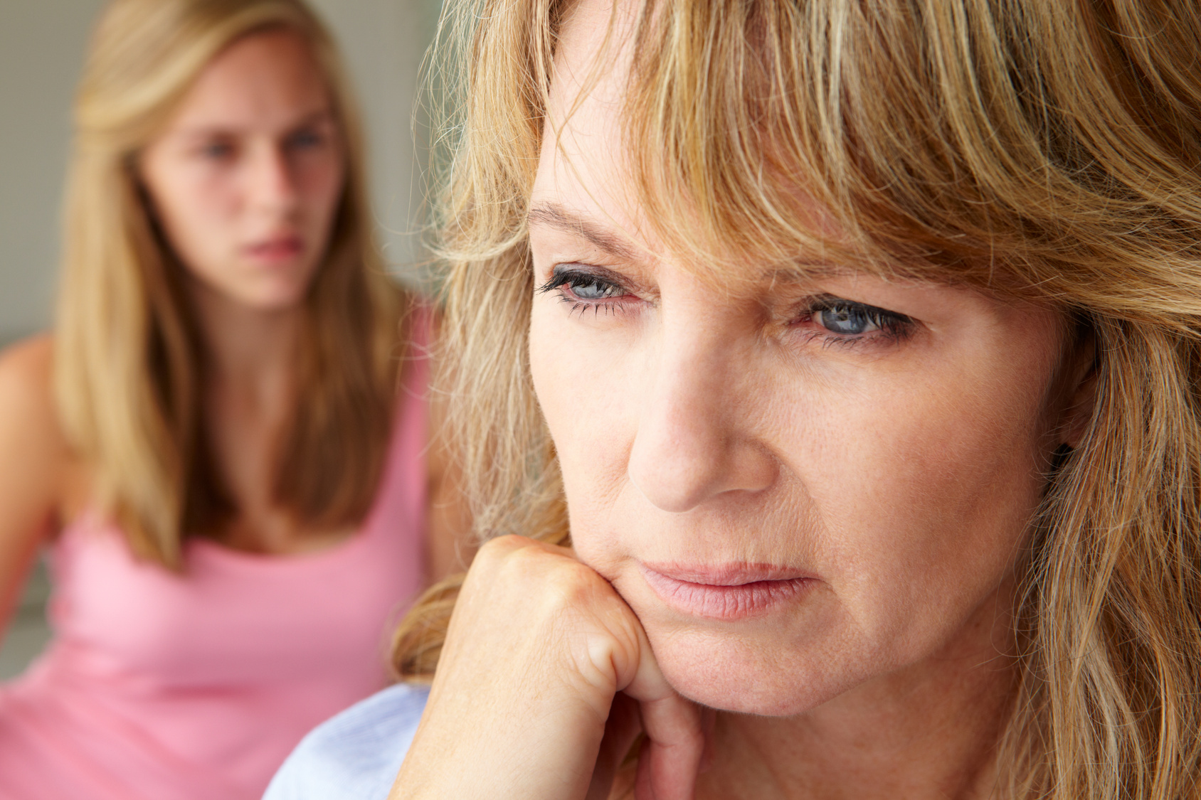 Unhappy mother with teenage girl