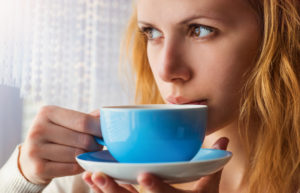 woman drink coffee blue cup