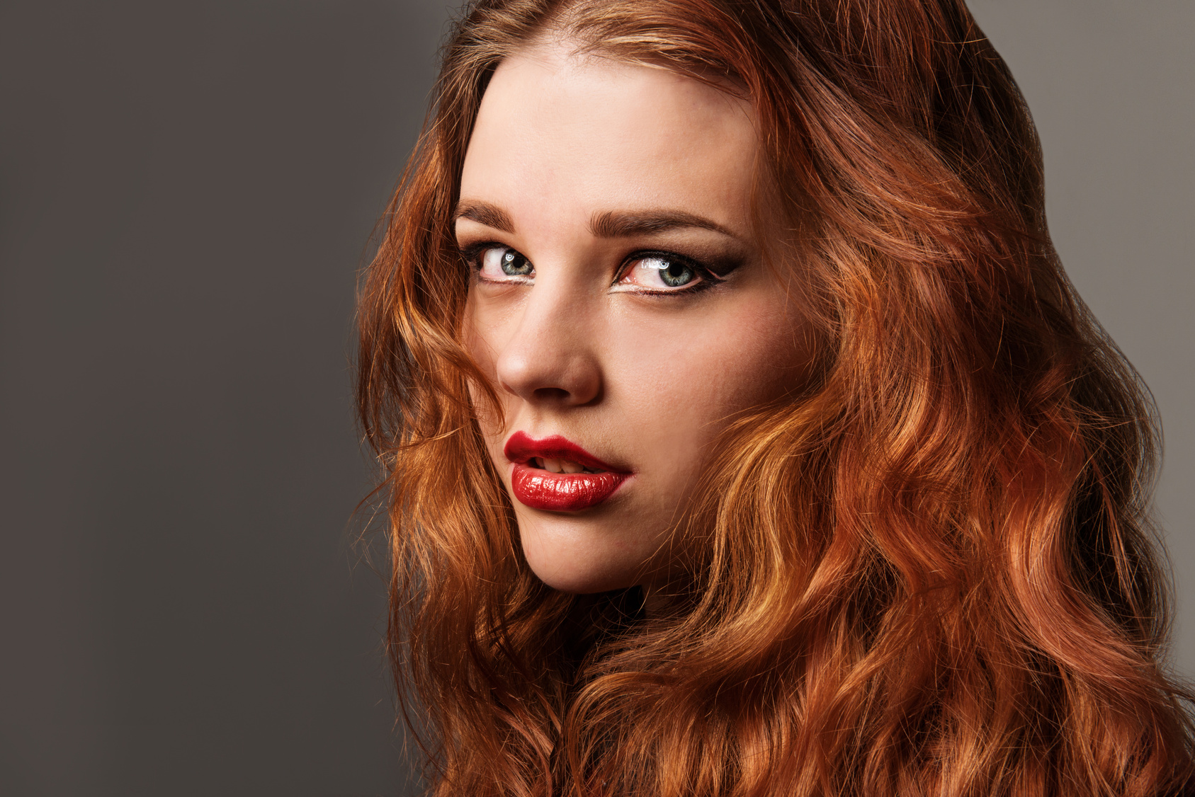 Long Curly Red Hair. Fashion Woman Portrait.