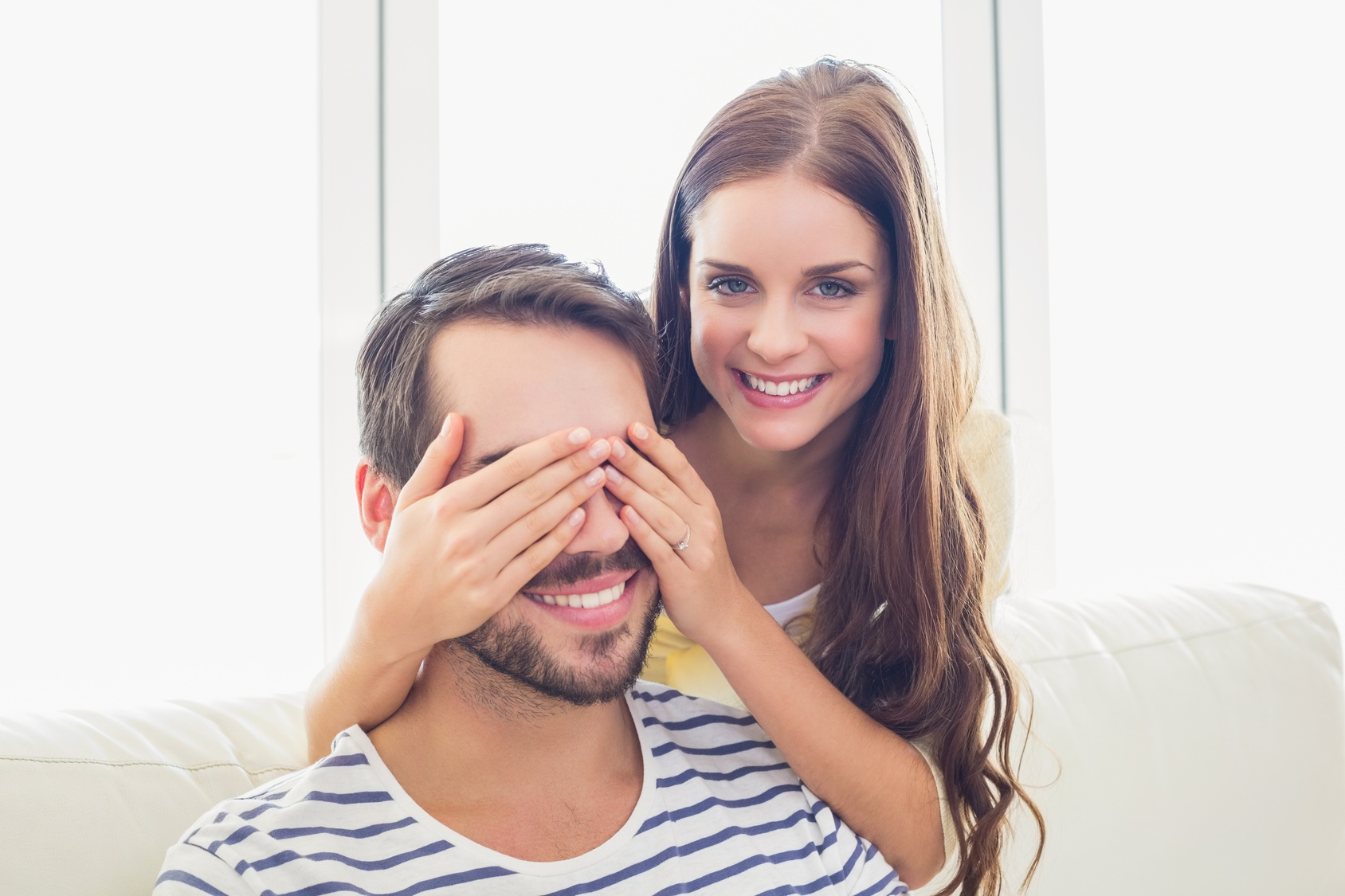 Pretty woman surprising her boyfriend