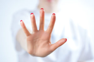 Young woman showing palm