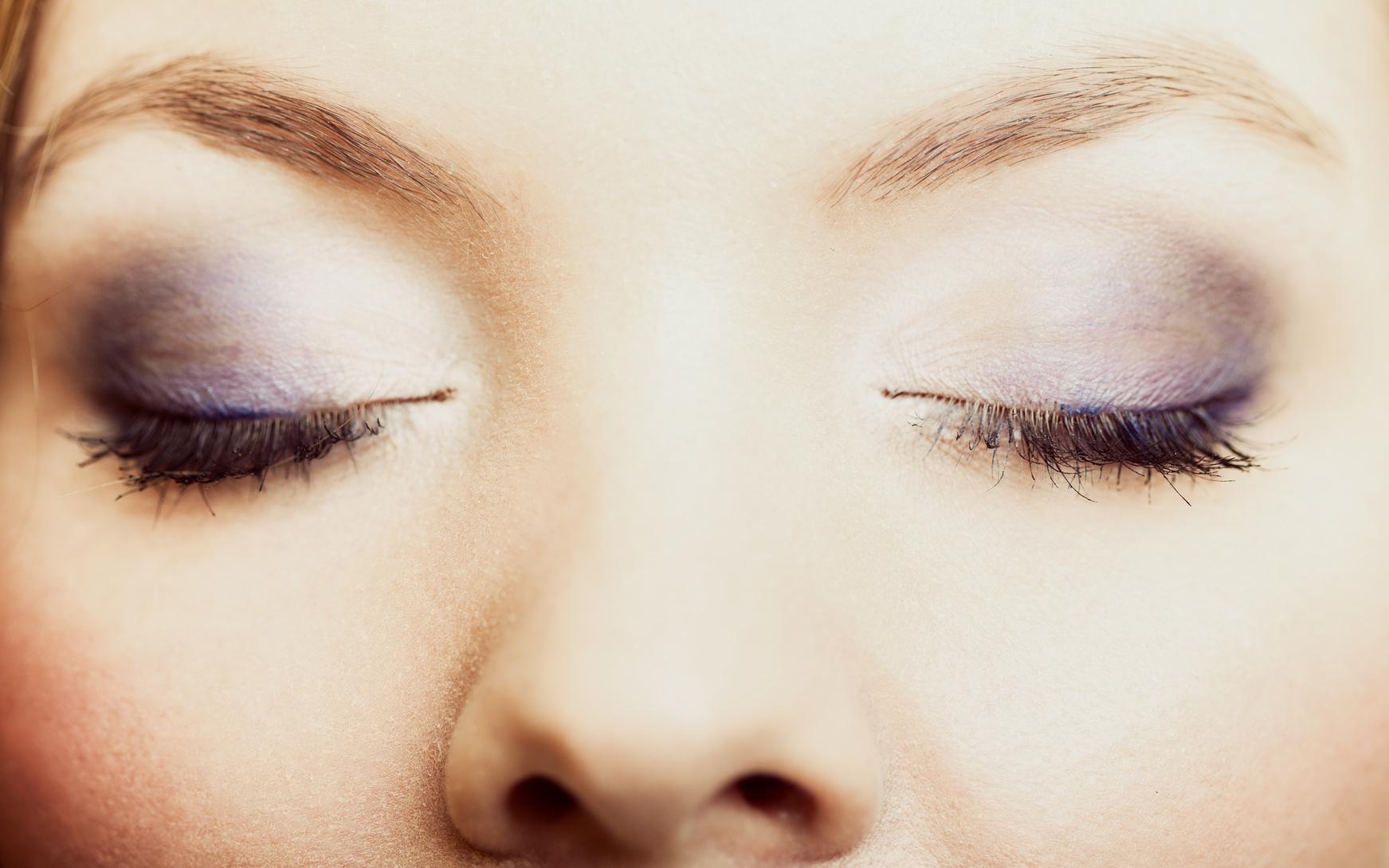 Closeup beautiful female eyes with make-up visage.