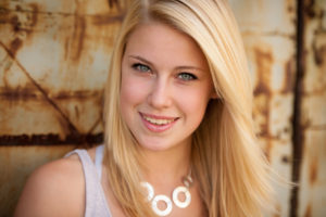 young blonde caucasian girl alone on a street
