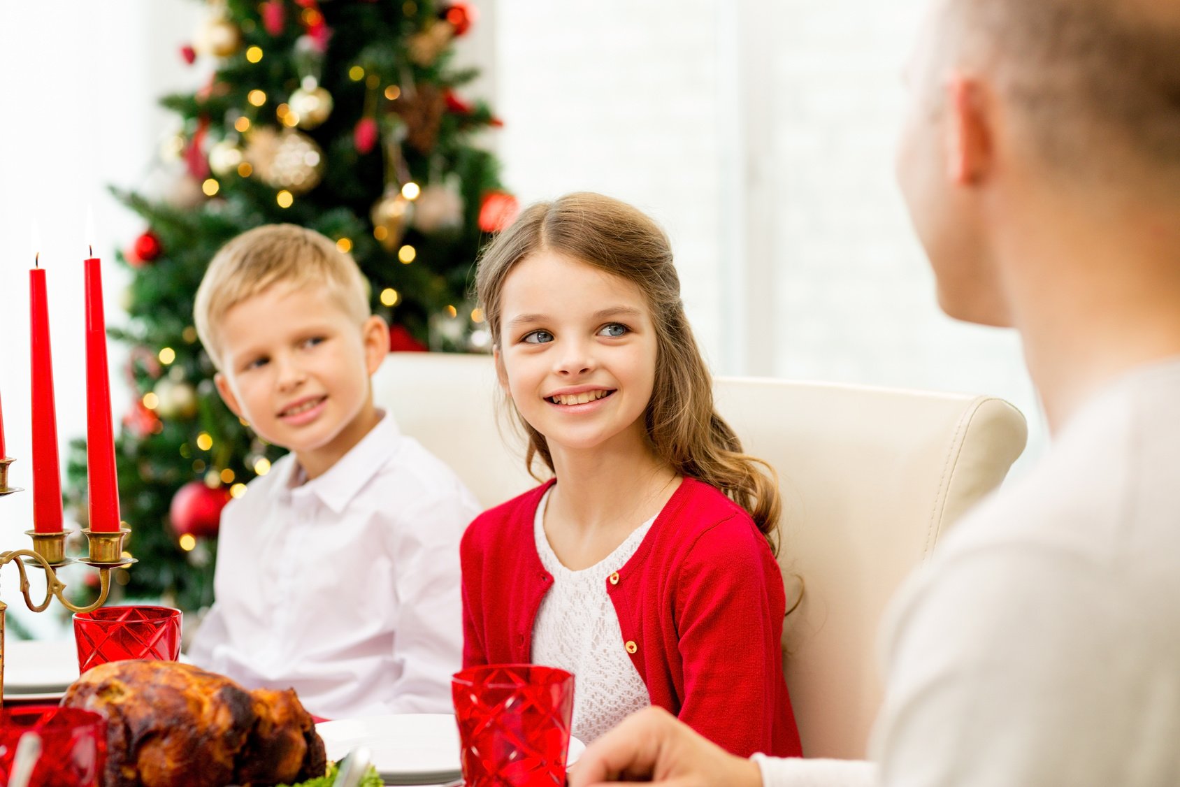 smiling family having holiday dinner at home