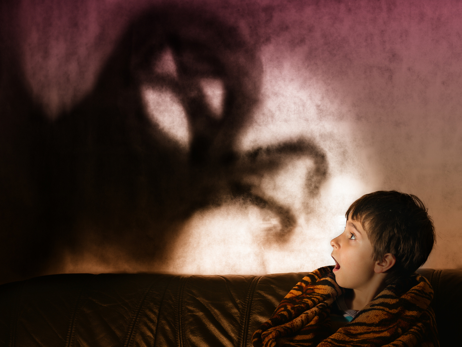 The boy is afraid of ghosts at night