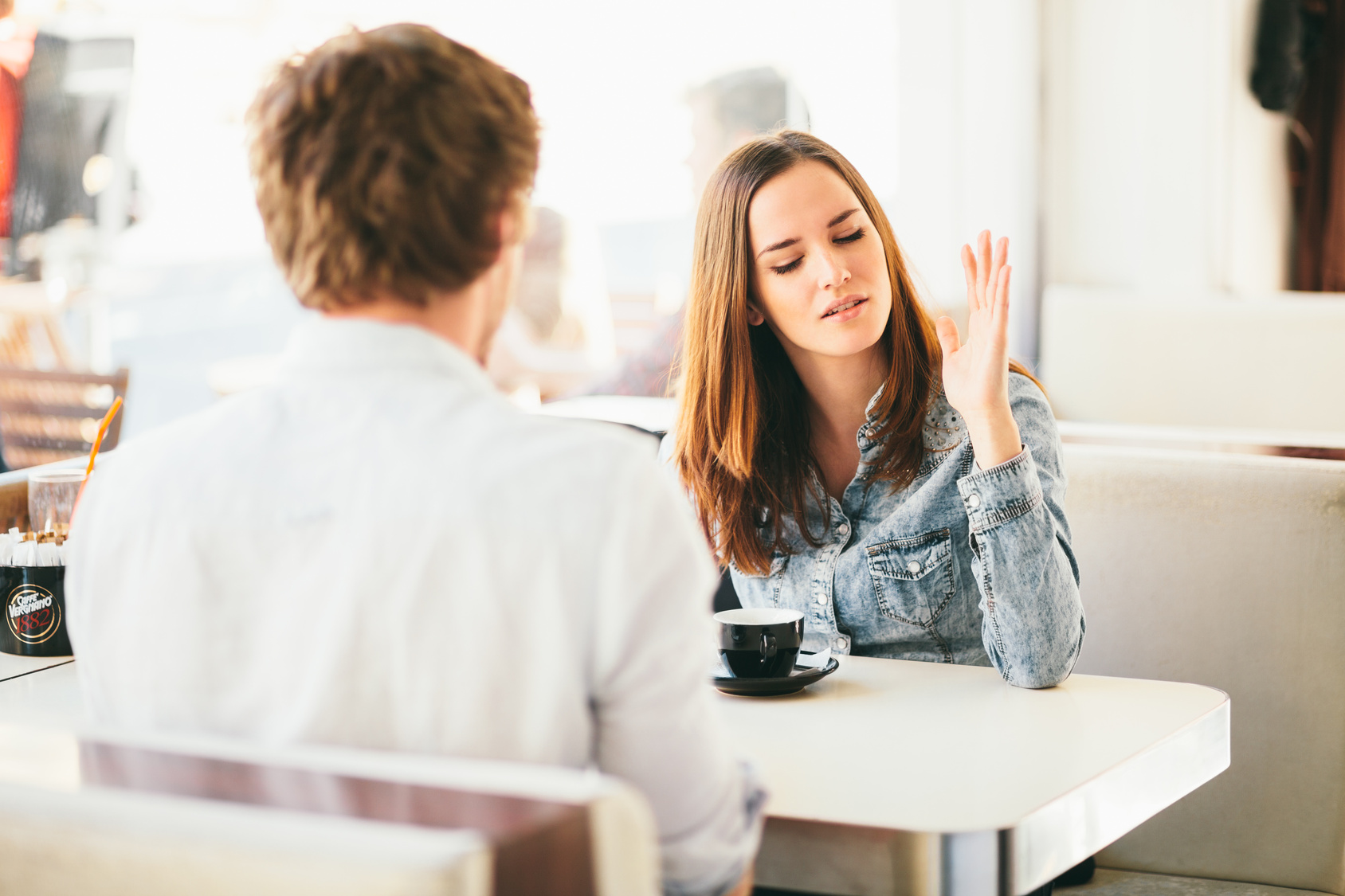 Young couple fighting in cafe