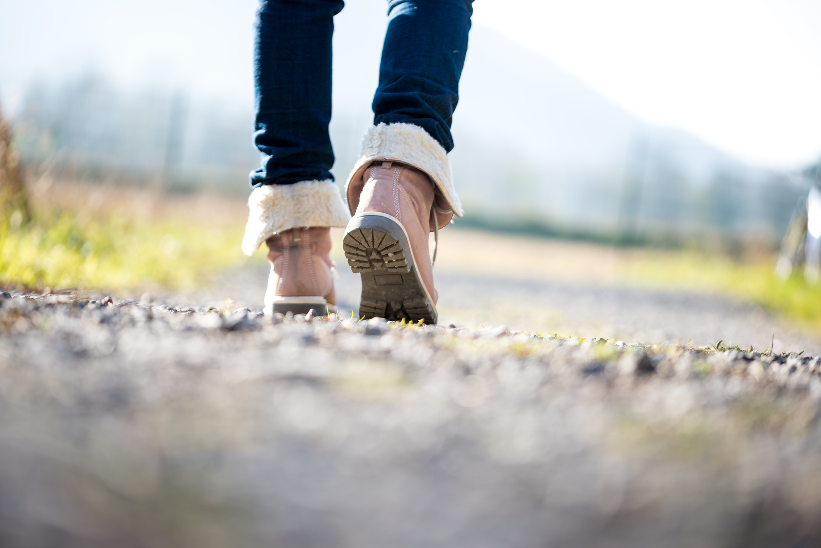 Woman walking along a rural path