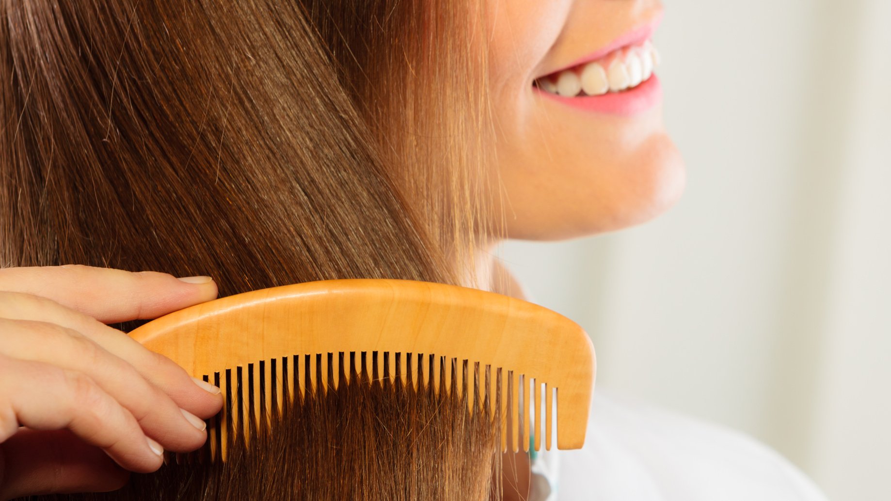 beautiful woman with long hair and comb