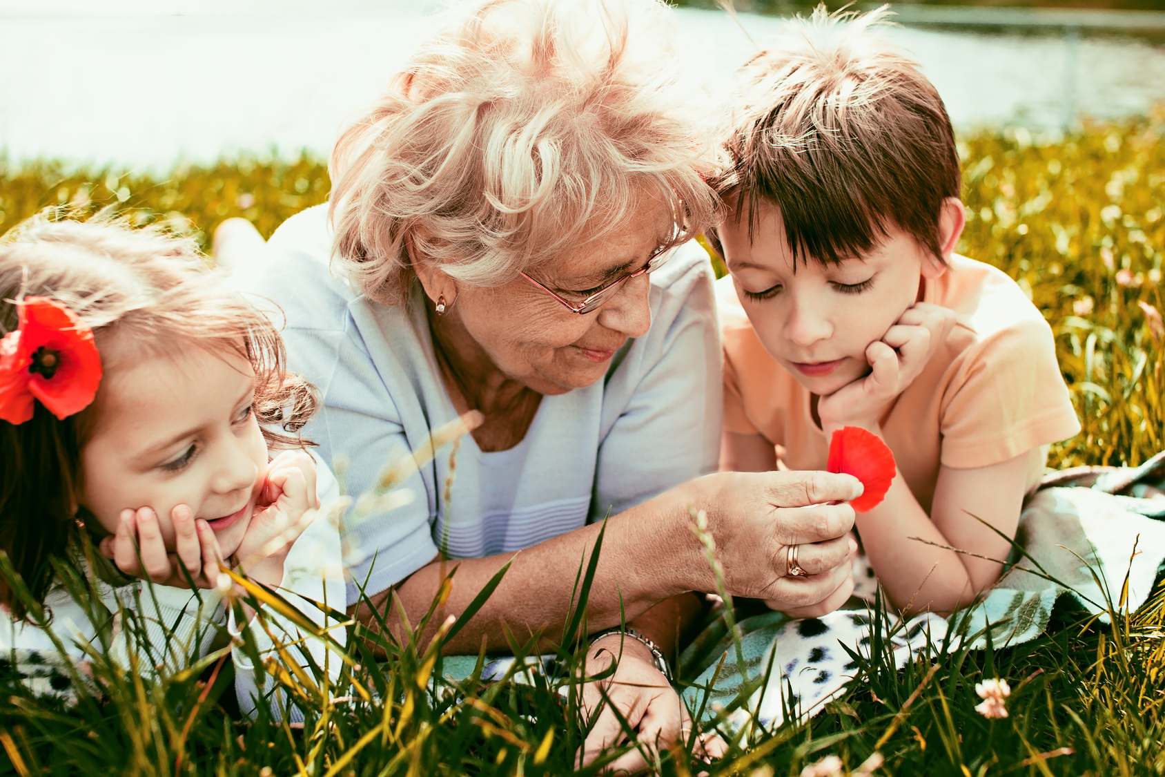 happy grandmother with grandchildren outdoors