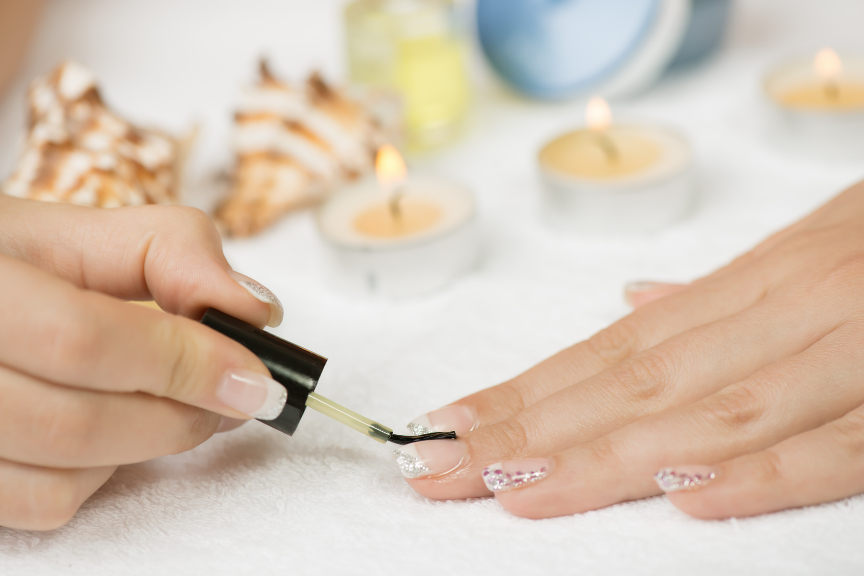 Manicure treatment – applying cuticle oil