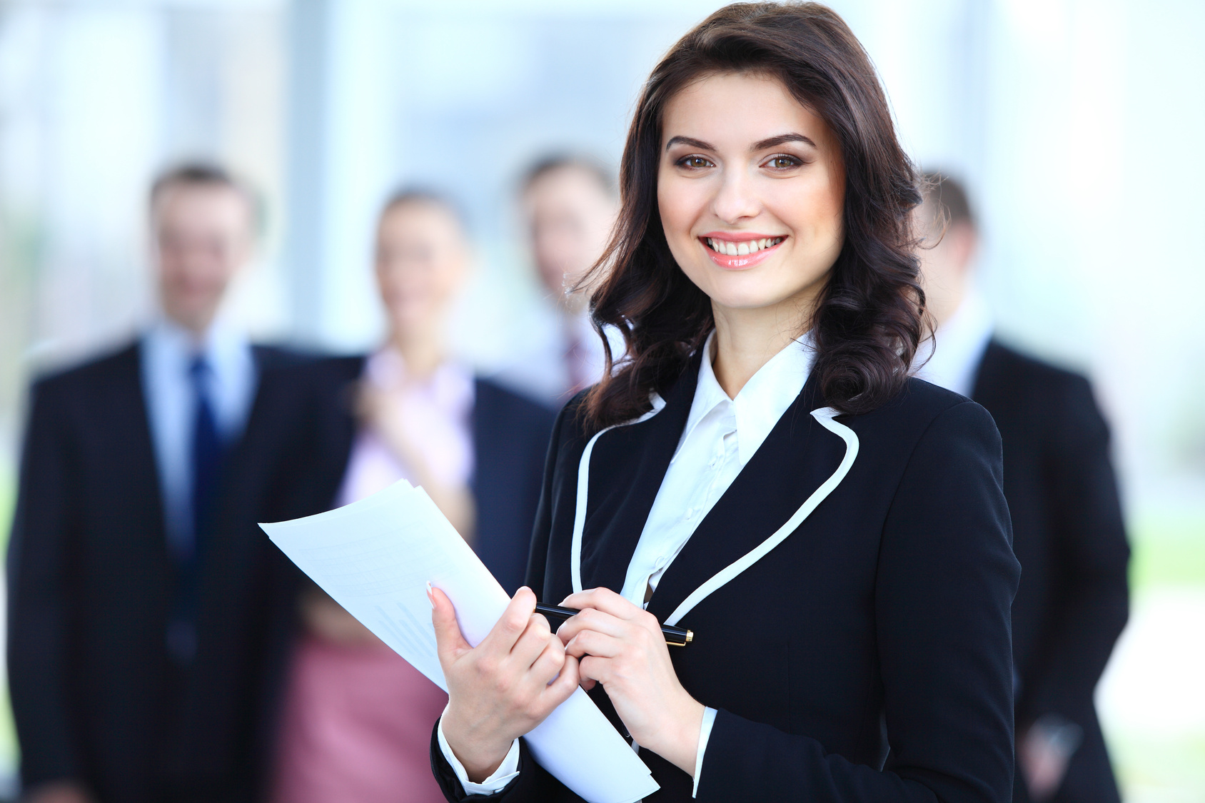 Face of beautiful woman on the background of business people