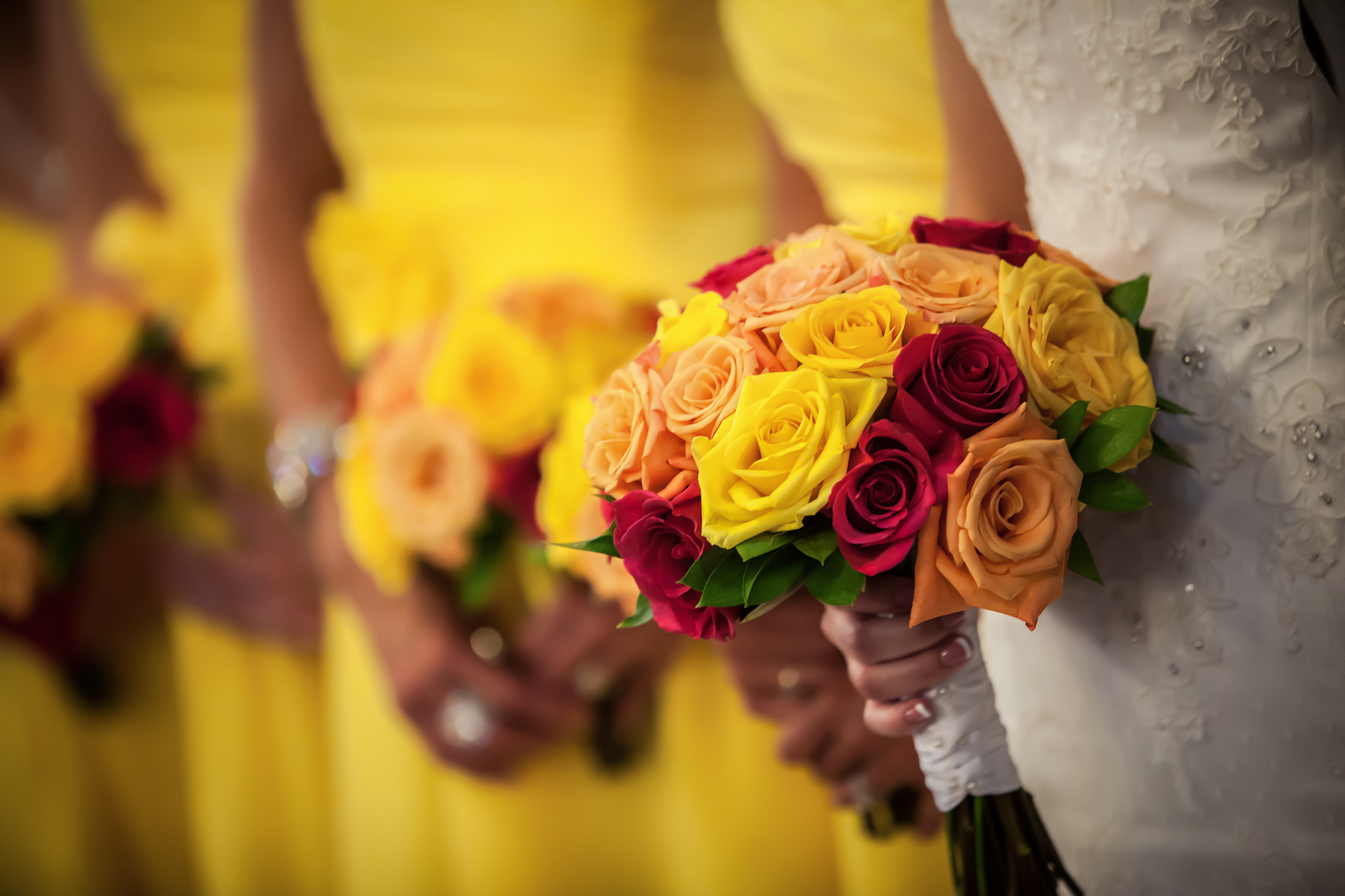 Bride Holding Bouquet with Bridesmaids in Background