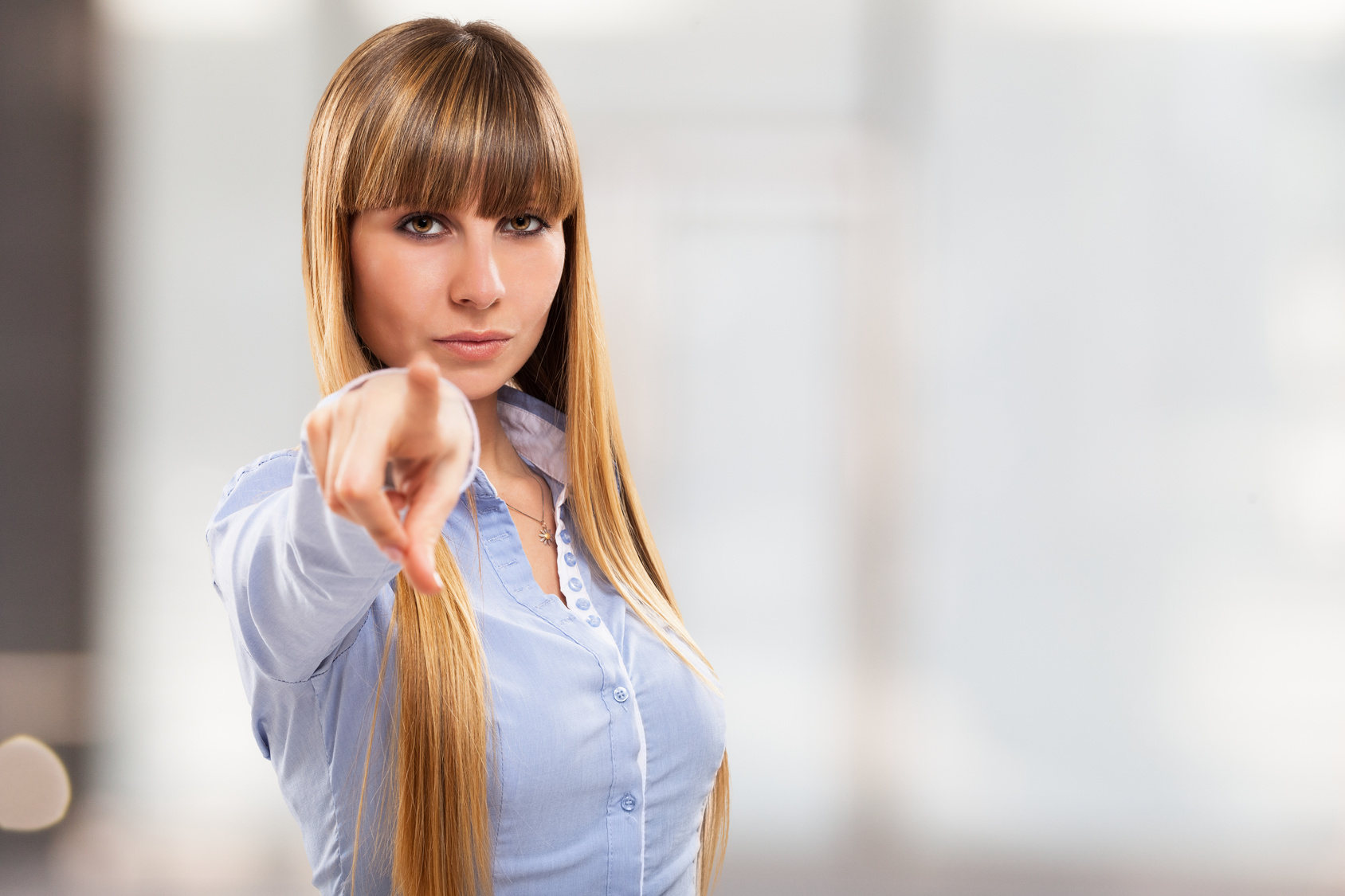 Young woman portrait pointing her finger