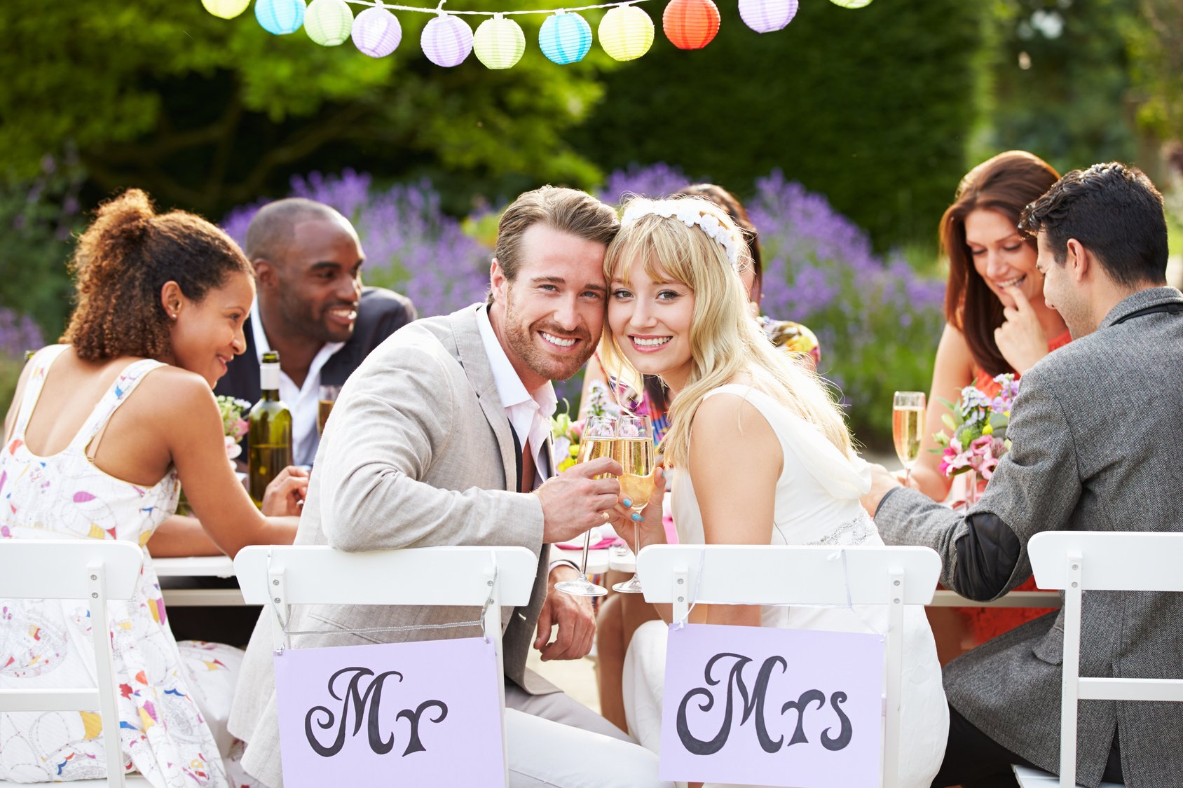 Bride And Groom Enjoying Meal At Wedding Reception