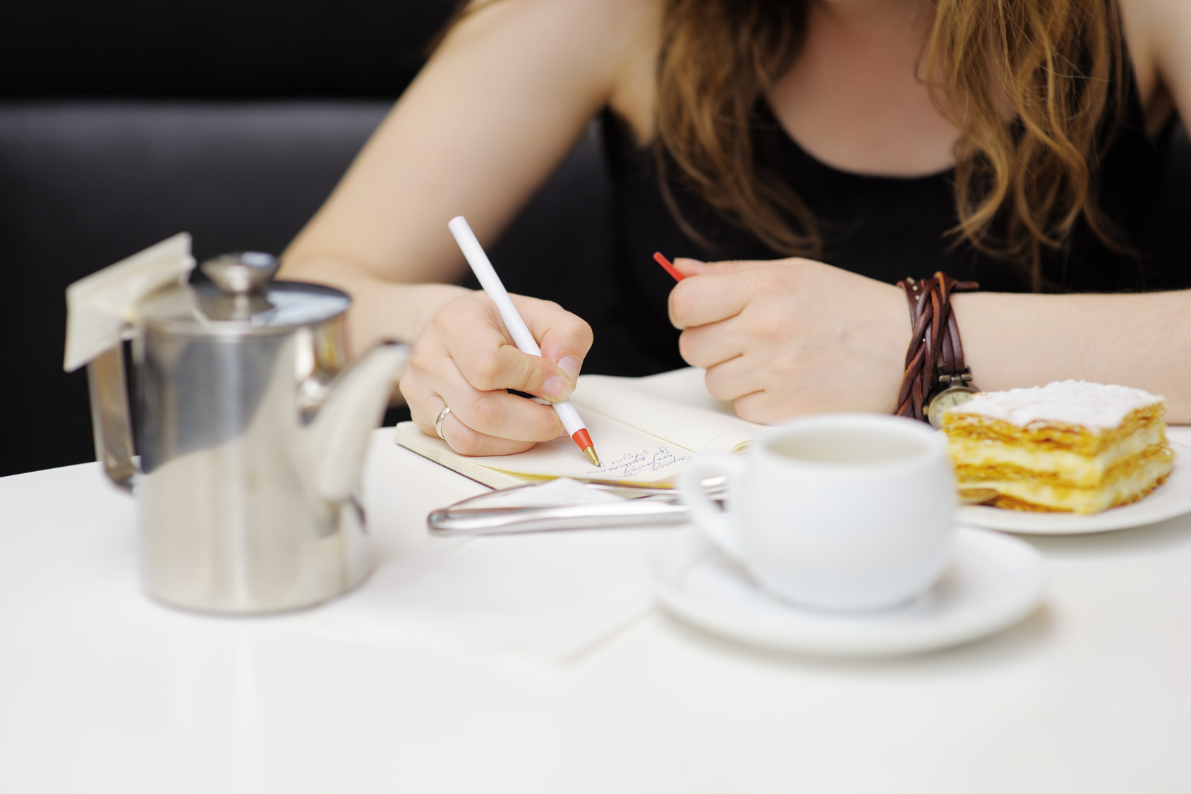 Young woman working in a cafe