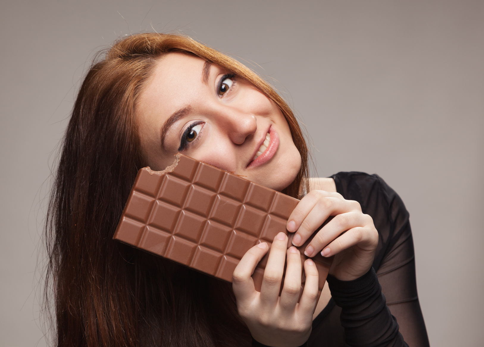 Portrait of sweet girl with the big chocolate