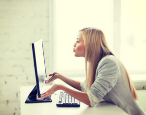 happy woman with laptop computer
