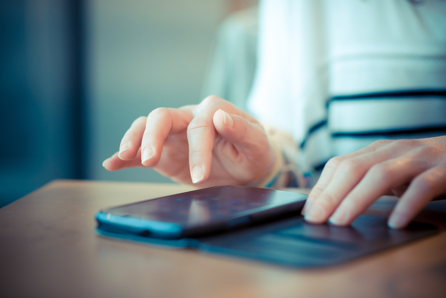 close up of woman hands using smart phone