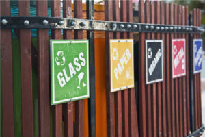 recycle bin place with signs like glass, paper, metal