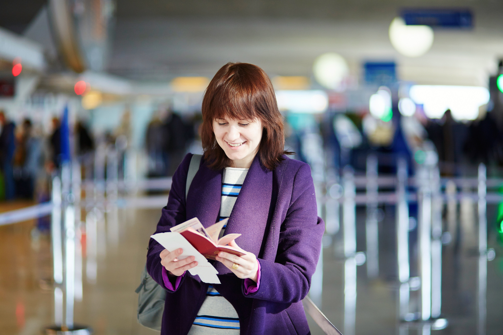 Young female passenger at check-in counter