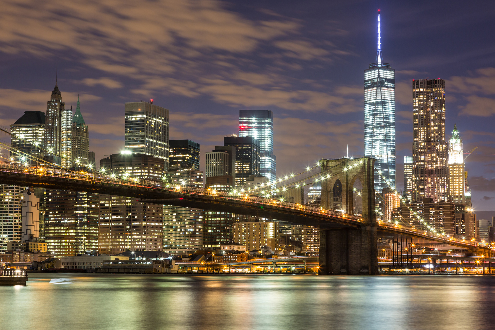 Brooklyn Bridge and Downtown Skyscrapers in New York at Dusk