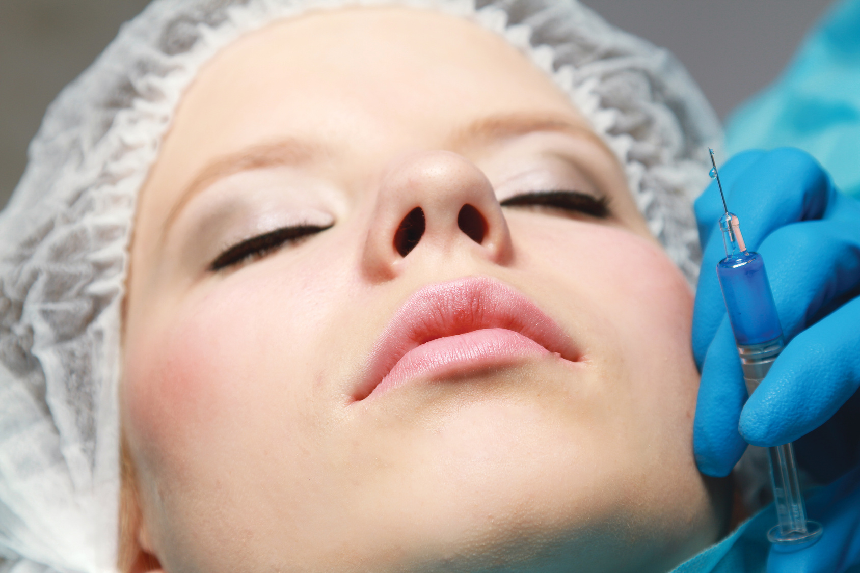 A woman receiving an injection