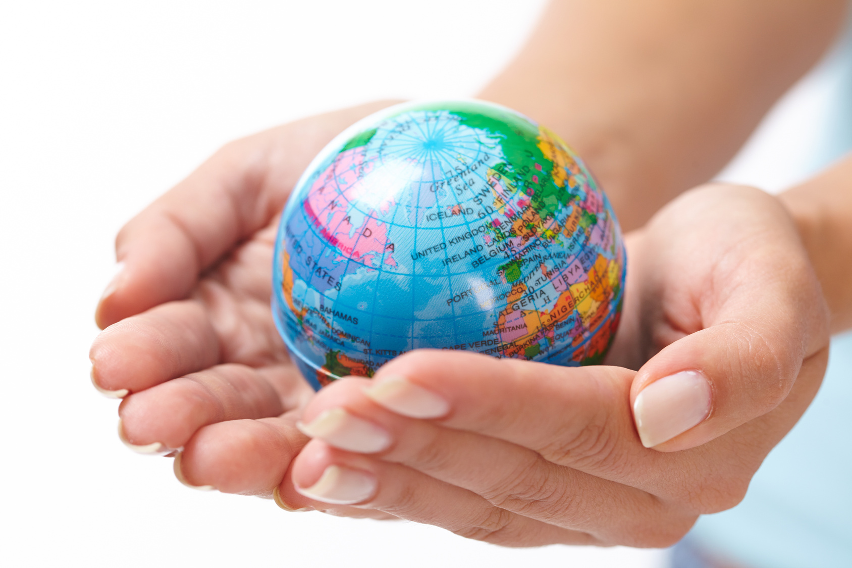 woman’s hand with globe