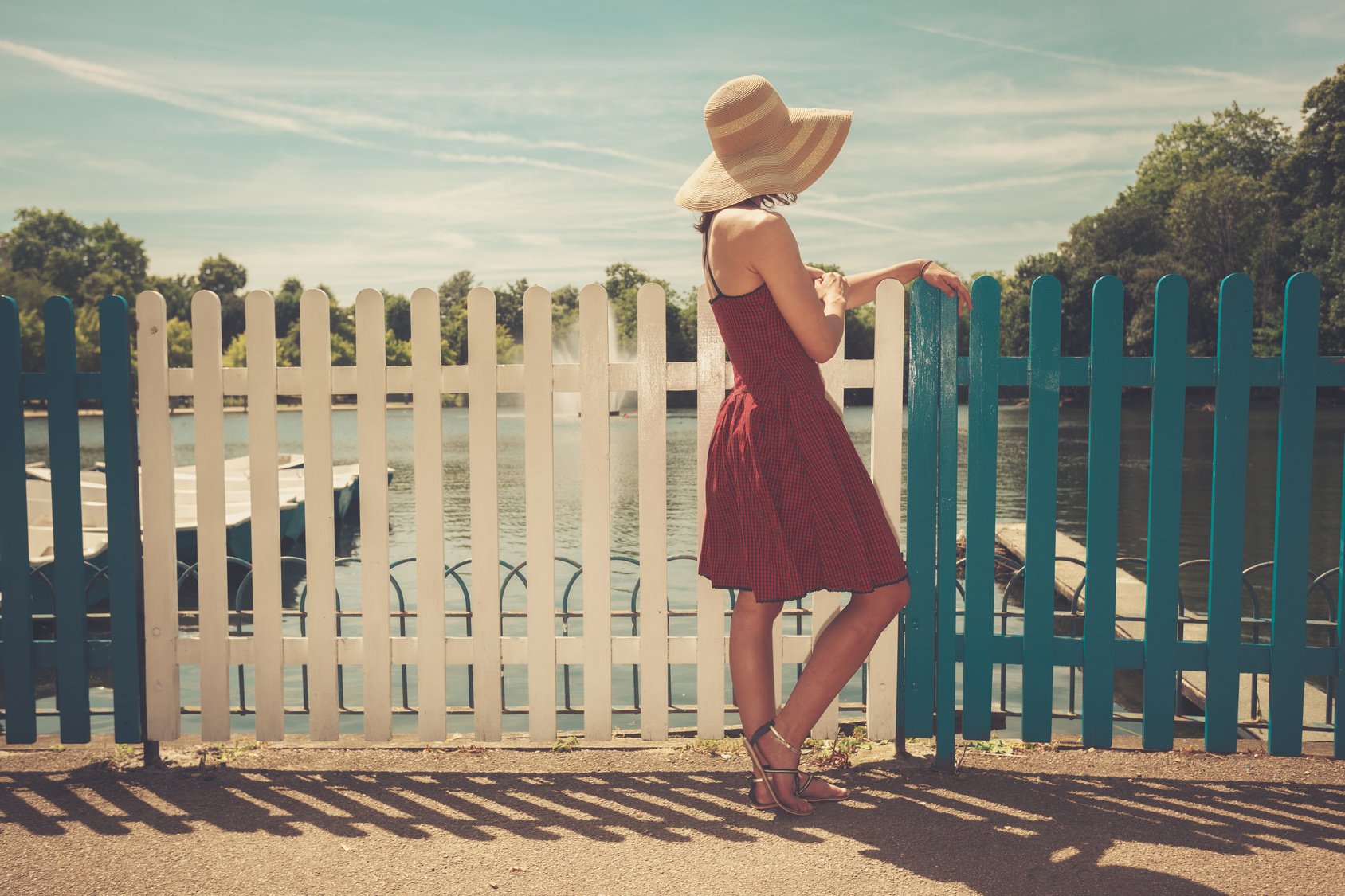 Young woman admiring boating lake