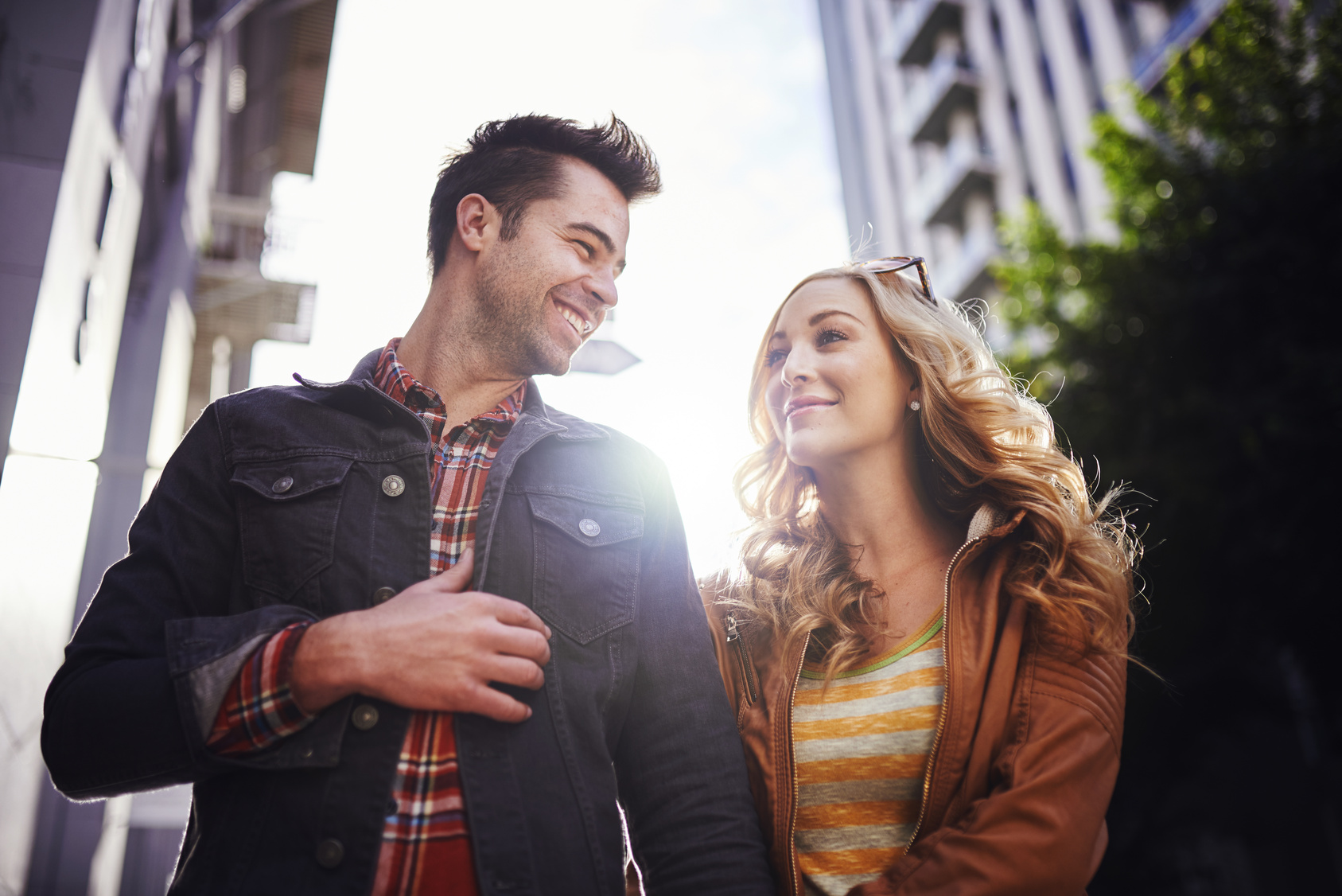 romantic couple walking through downtown los angeles