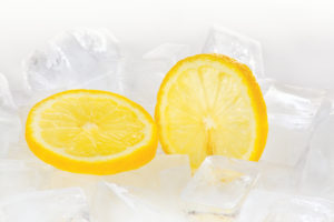 Two slices of lemon on ice cubes
