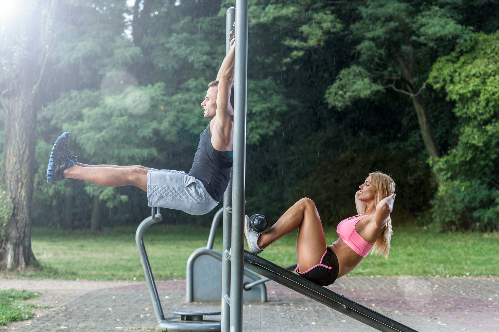 Couple working out on outdoor gym