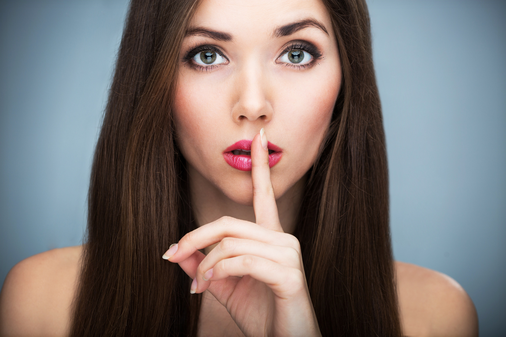 Woman making silence gesture