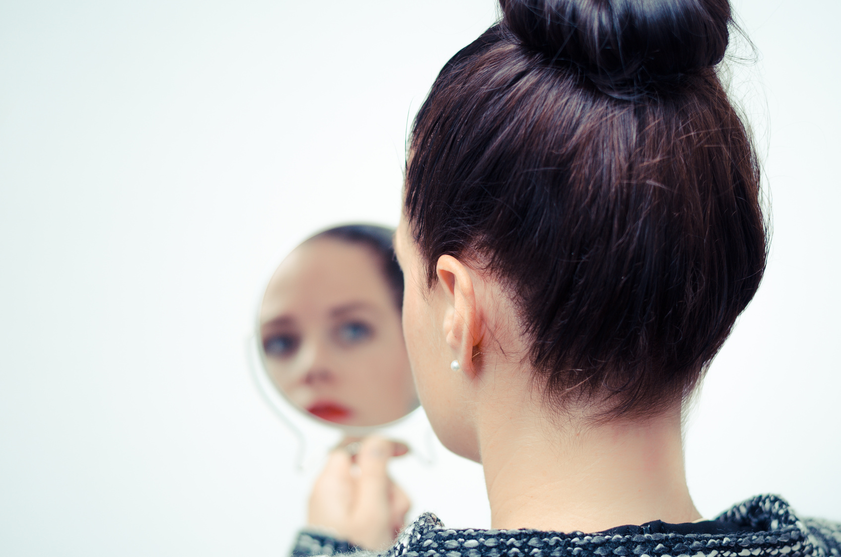 businesswoman looking in the mirror and reflecting